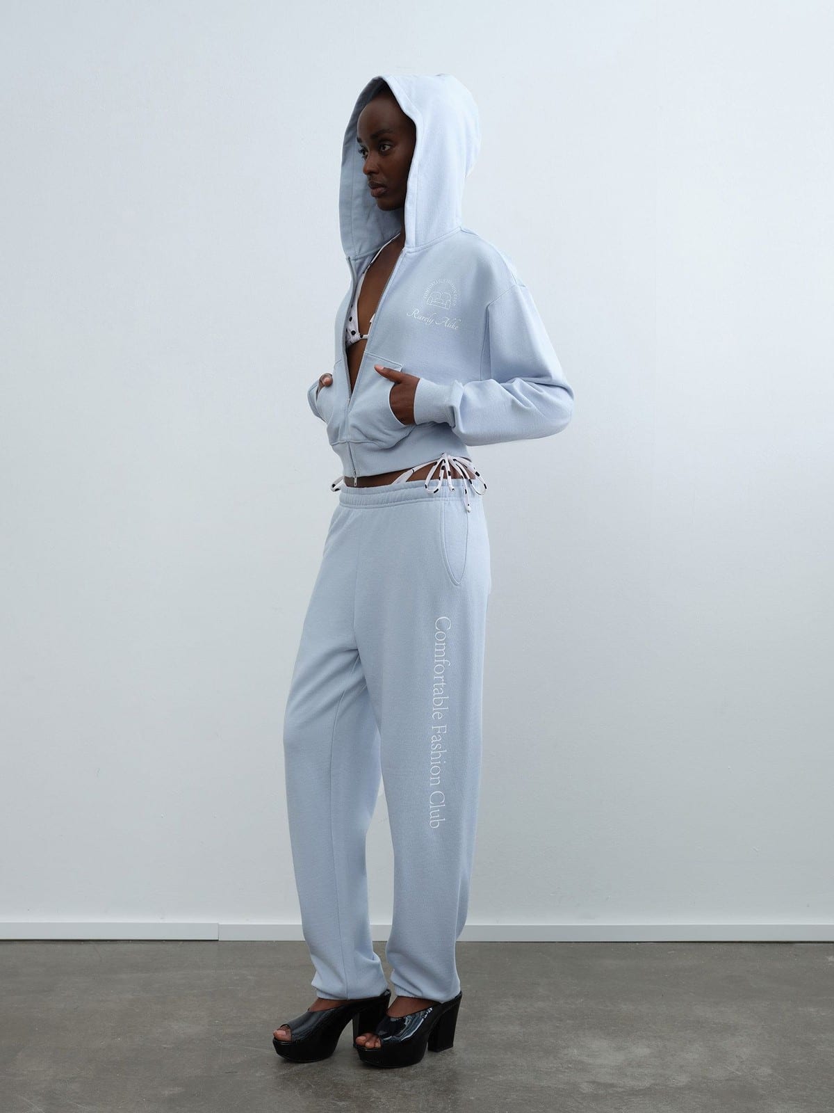 RARELY ALIKE Graphic Cropped Zip Up Hoodie in Sky Blue - On Female Model