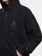 BLINDNOPLAN Washed Distressed Graphic Zip Hoodie in Black - On Male Model