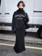 RARELY ALIKE Double Waistband Mermaid Maxi Skirt in Black - On Female Model