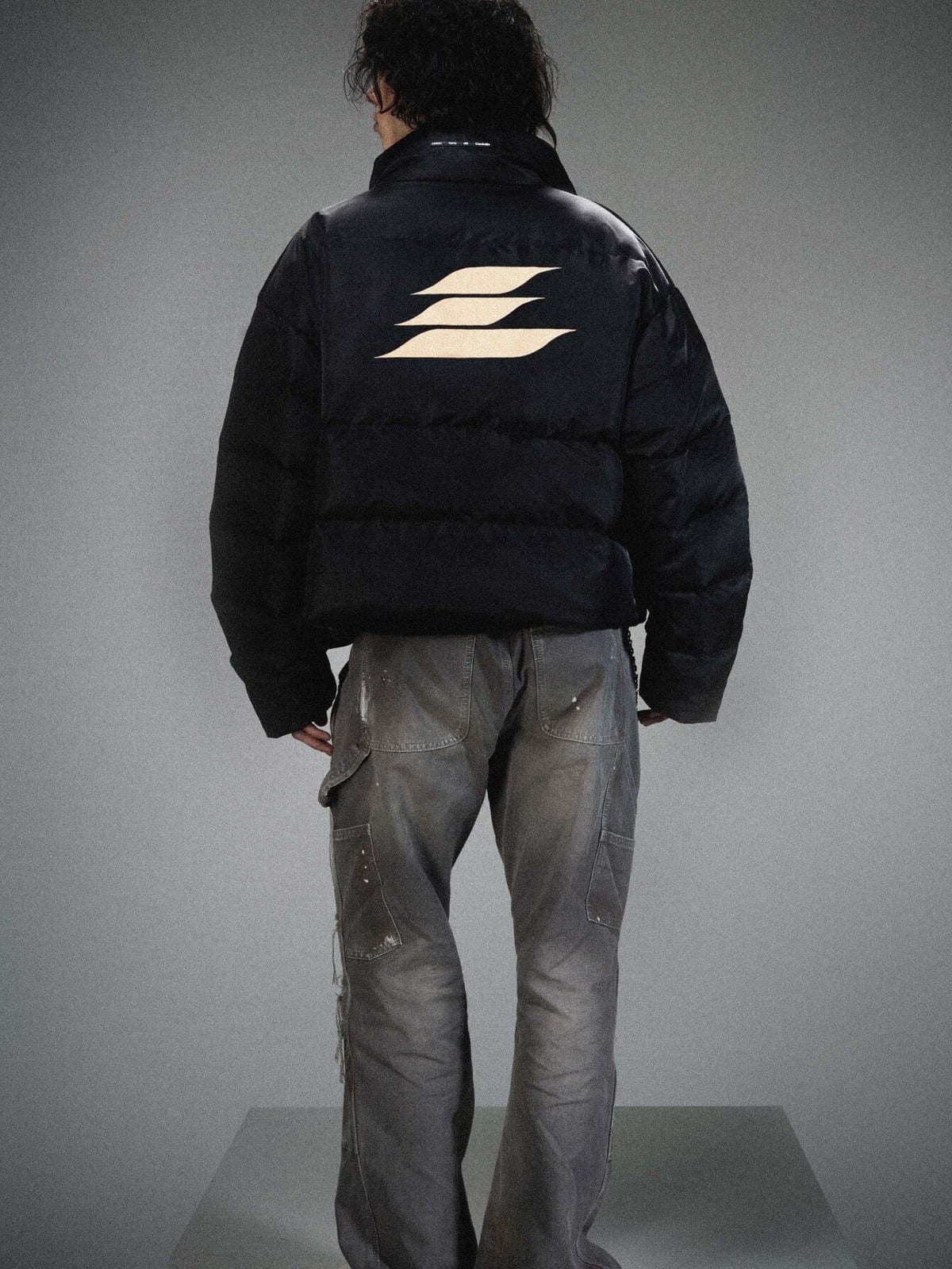 LOSTCTRL Minimalist Nylon Puffer Jacket in Black - On Model