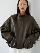 MSBEAST Oil Waxed Sheepskin Stand Collar Jacket in Olive - On Female Model