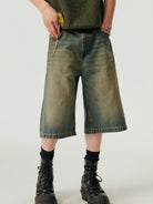 SIMPLE PROJECT Distressed Heavy Wash Denim Shorts in Blue - On Model