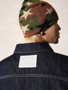 MEDM Embroidered Cuff Raw Denim Jacket in Blue - On Model