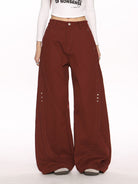 BIGGOLD STUDIO Deconstructed Curved Seam Trousers in Burgundy - On Female Model