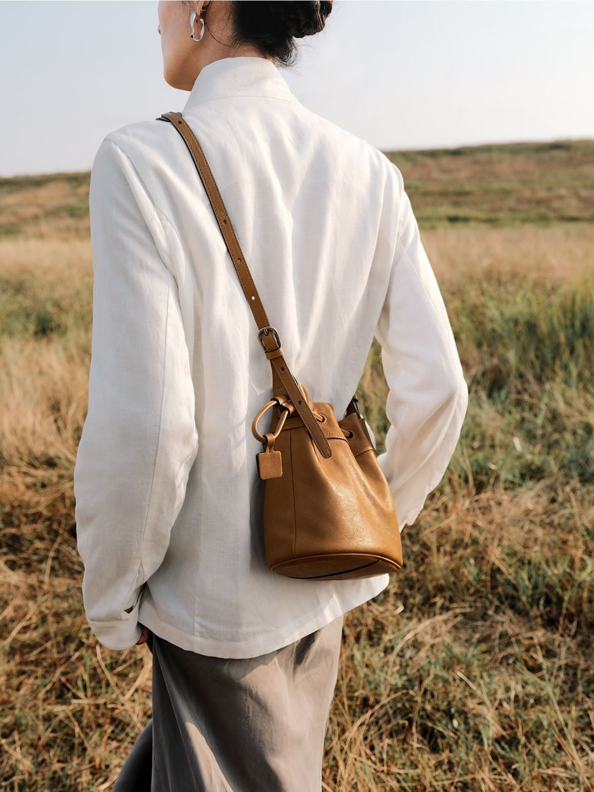 QIUZHEN Kidskin Drawstring Bucket Bag in Brown - On Model