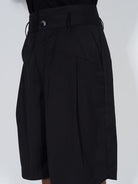 BLINDNOPLAN Asymmetric Striped Suit Shorts in Black - On Model