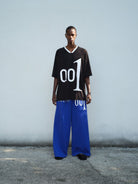 TRIANGLE PROJECT 001 Graphic V Neck Jersey Tee in Black - On Male Model