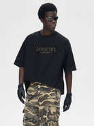 LOSTCTRL Heavyweight Cotton Rivet Logo T Shirt in Black - On Male Model