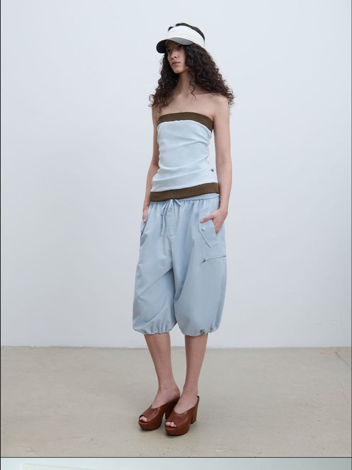 RARELY ALIKE Cropped Cotton Lantern Cargo Shorts in Sky Blue - On Female Model