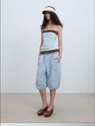 RARELY ALIKE Cropped Cotton Lantern Cargo Shorts in Sky Blue - On Female Model