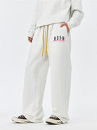 MEDM Fleece Lined Embroidered Sweatpants in White - On Model