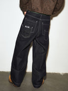 MEDM Contrast Stitch Denim Cargo Jeans in Navy Blue - On Model