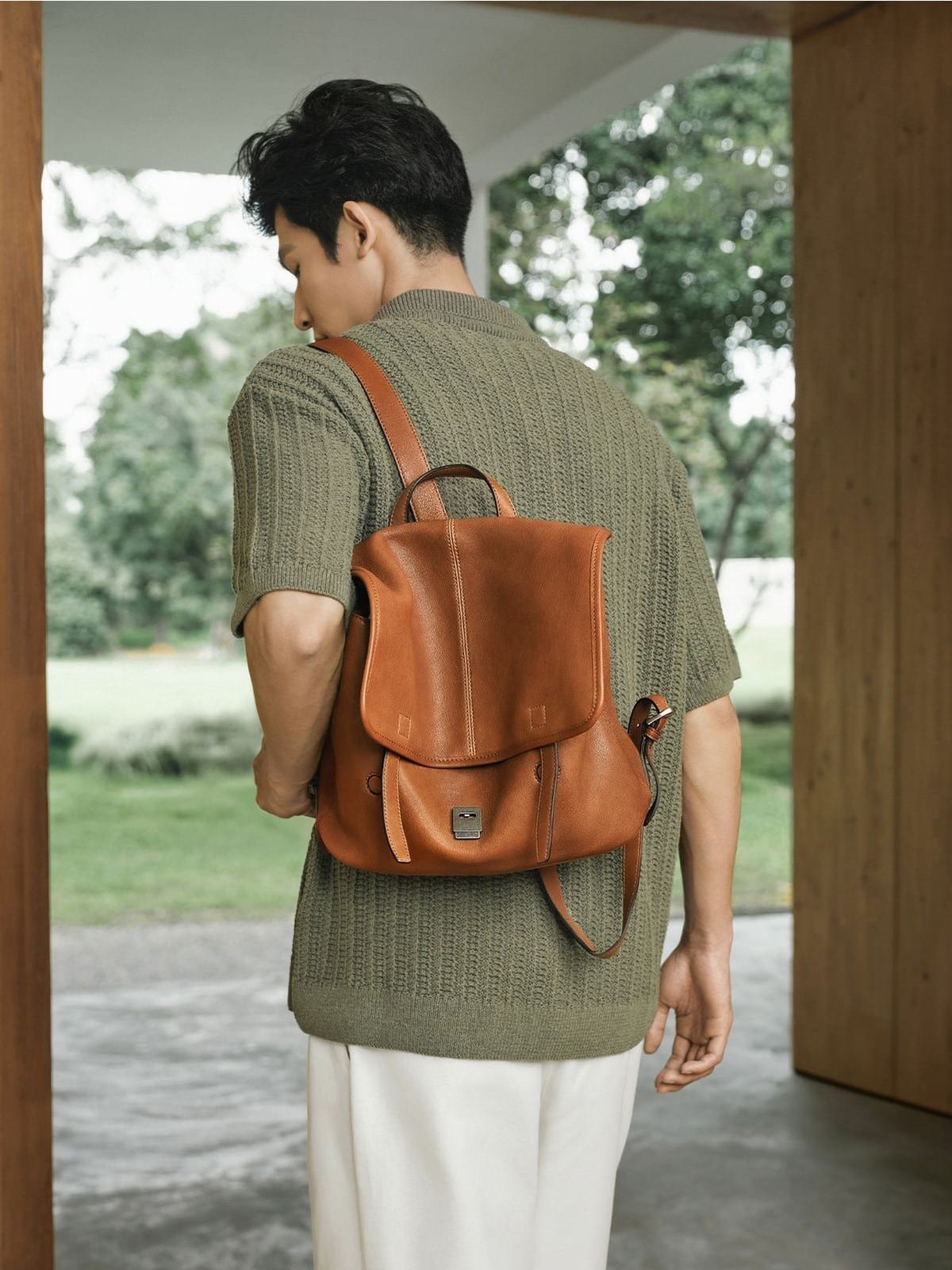 QIUZHEN Vegetable Tanned Goatskin Messenger Backpack in Brown - On Male Model