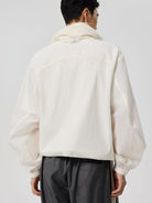 SIMPLE PROJECT Lightweight Offset Zip Jacket in White - On Model