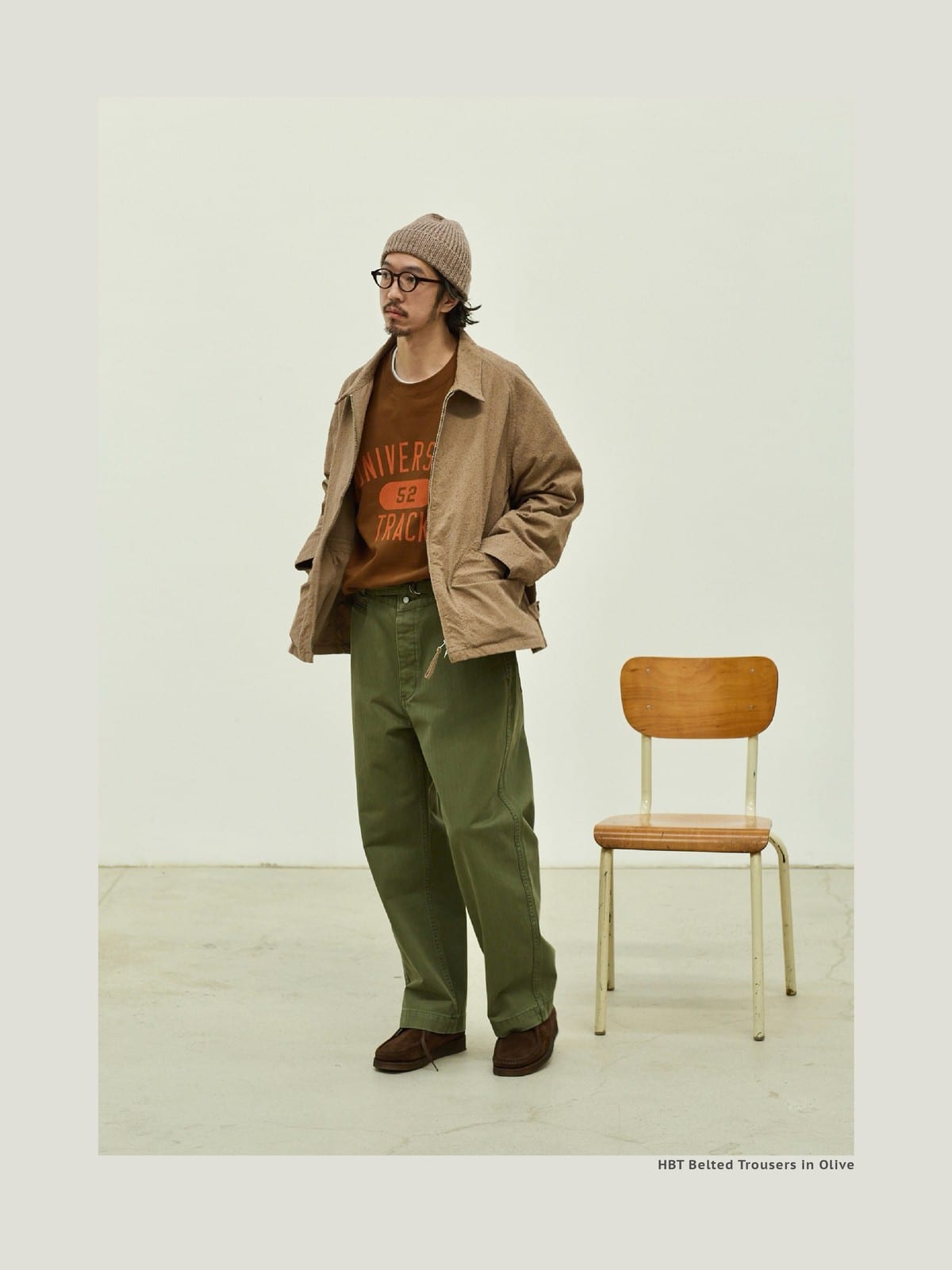 USAGE Heavyweight Herringbone Twill Belted Trousers in Olive - On Male Model