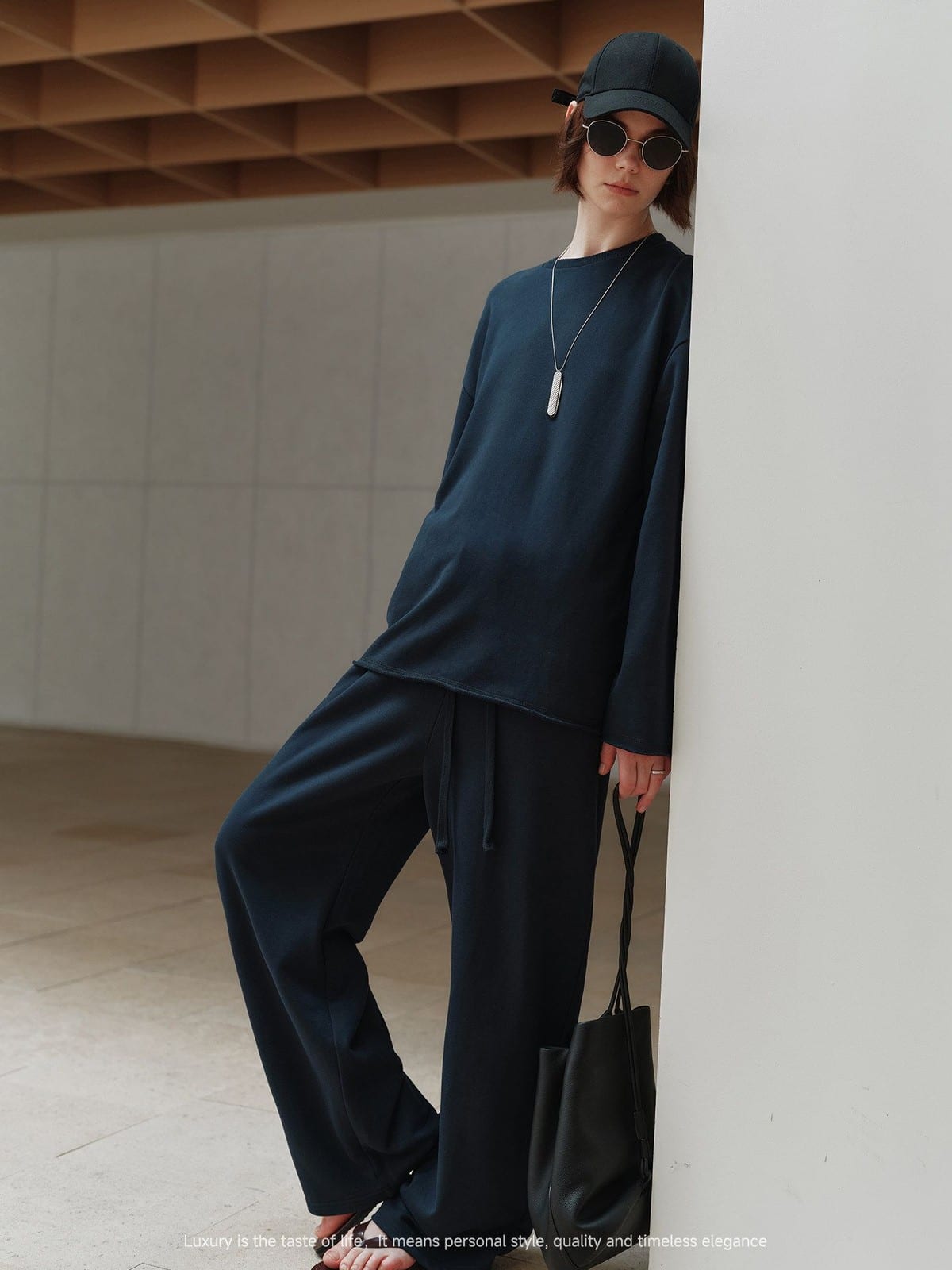MSBEAST Cotton Terry Sweatshirt Tapered Joggers in Navy Blue - On Female Model