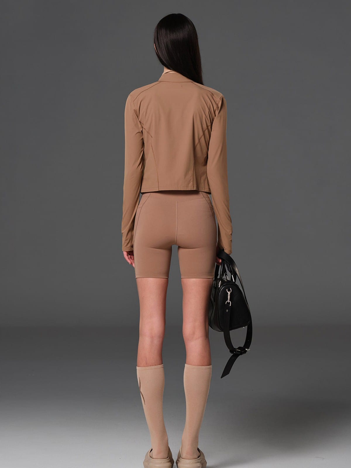 SMFK Cropped Stretch Nylon Track Jacket in Brown - On Female Model