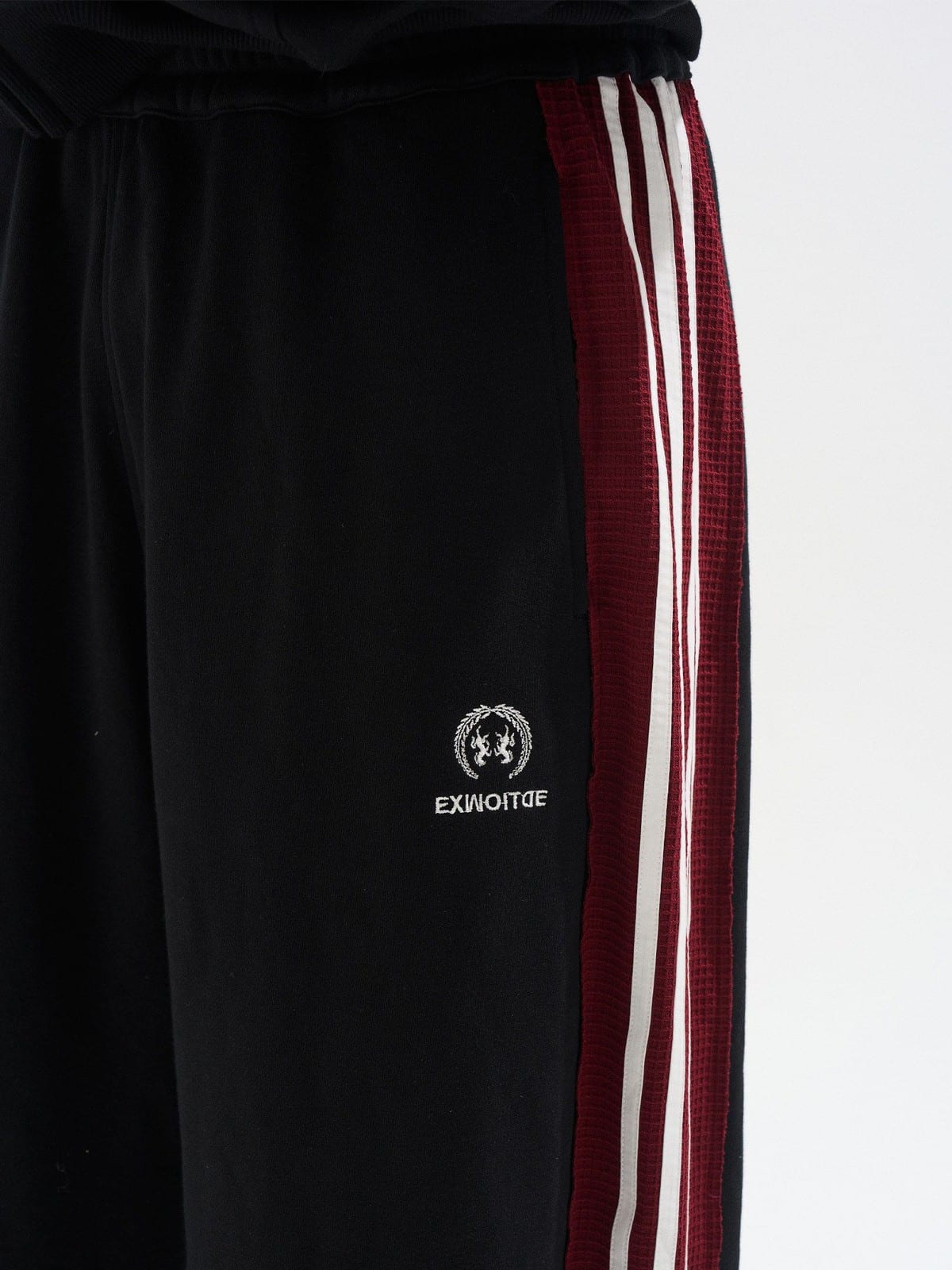 BLINDNOPLAN Raw Edge Contrast Paneled Sweatpants in Black - On Model