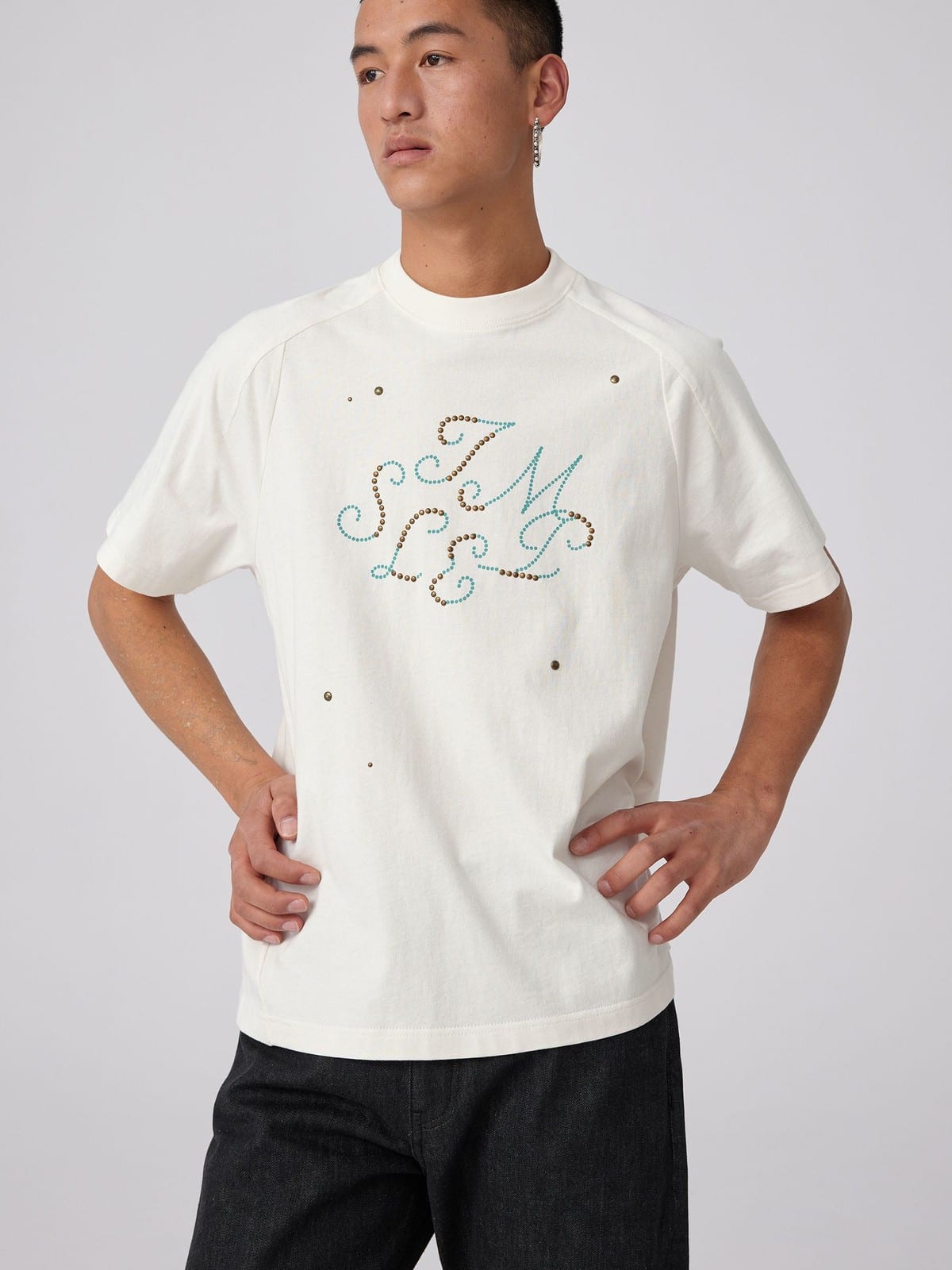 SIMPLE PROJECT Brass Stud Retro Logo Cotton T Shirt in White - On Male Model