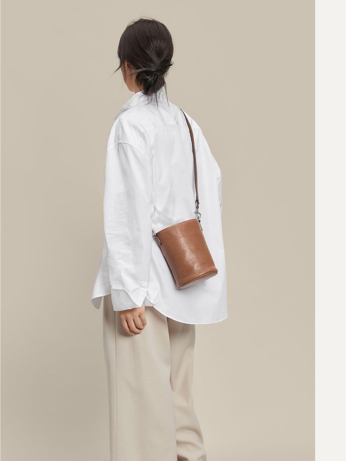 QIUZHEN Leather Drawstring Bucket Bag in Gray - On Female Model