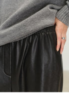 MSBEAST Cropped Wide Leg Leather Trousers in Black - On Model