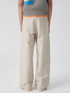 SIMPLE PROJECT Cotton Straight Leg Chino Trousers in Beige - On Model