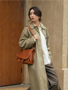 QIUZHEN Vegetable Tanned Leather Messenger Bag in Brown - On Female Model