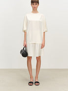 MSBEAST Oversized Acetate Satin T Shirt in White - On Female Model