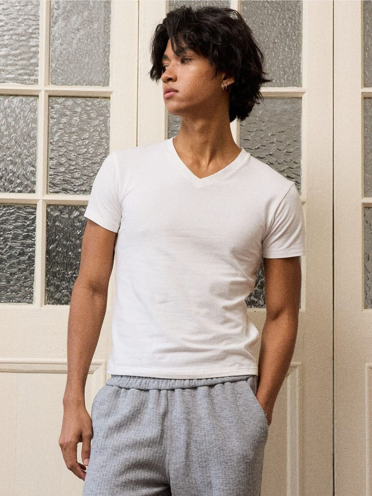 Retro 21 Anti Wrinkle V Neck T Shirt in White - On Male Model
