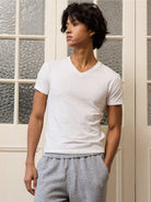 Retro 21 Anti Wrinkle V Neck T Shirt in White - On Male Model