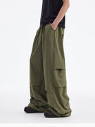 MEDM Crinkled Nylon Parachute Cargo Pants in Olive - On Male Model