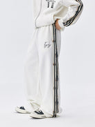 MEDM Lace Paneled Striped Track Pants in White - On Model