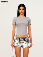 SMFK Embroidered Cross Crewneck Tee in Gray - On Female Model