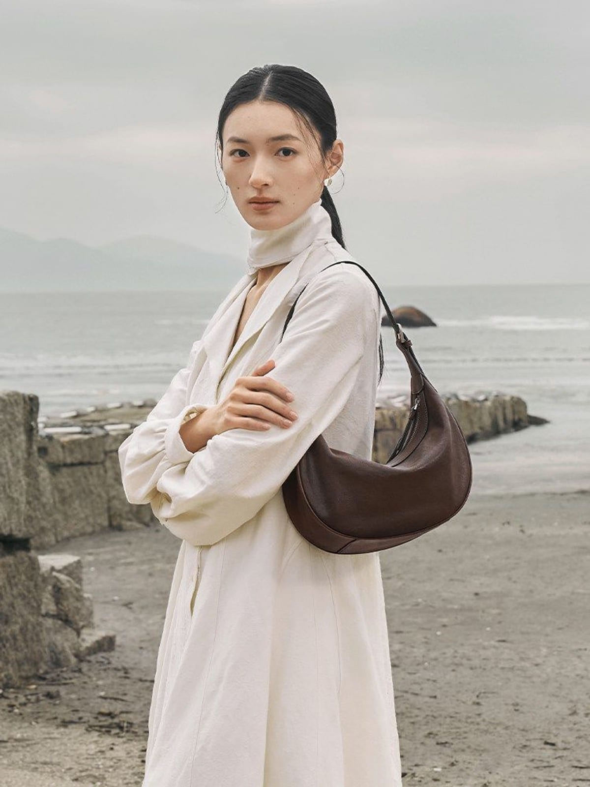 QIUZHEN Vegetable Tanned Leather Crescent Bag in Brown - On Female Model