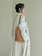 QIUZHEN Vegetable Tanned Leather Bucket Bag in Beige - On Female Model
