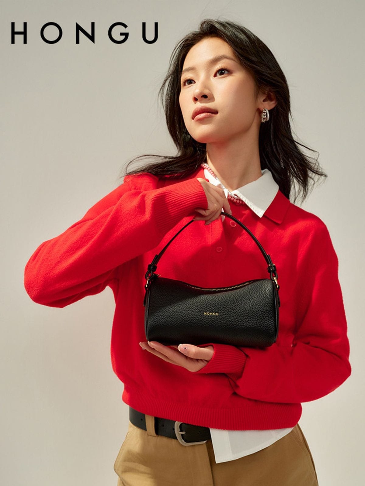 HONGU Leather Crossbody Pillow Bag in Black - On Female Model