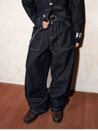 MEDM Contrast Stitch Raw Denim Jeans in Blue - On Model