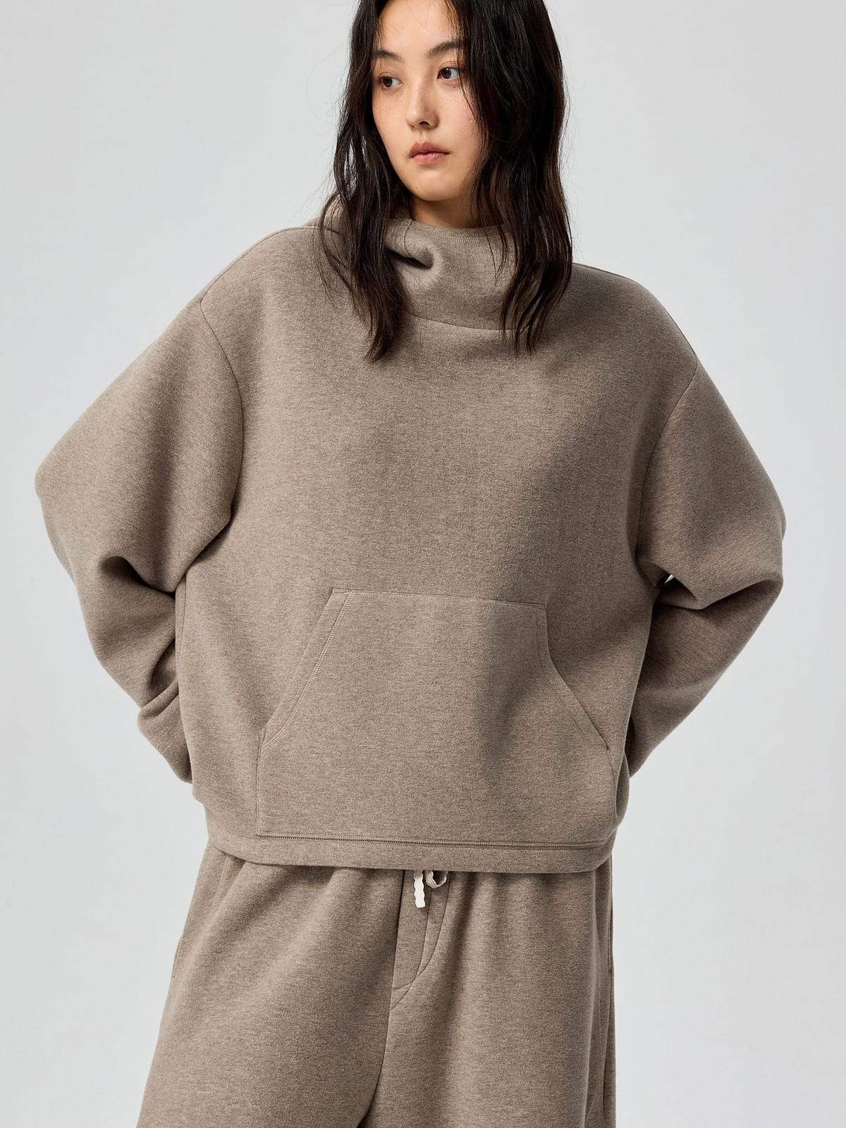 SIMPLE PROJECT High Neck Fleece Blend Hoodie in Beige - On Female Model