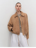 MSBEAST Cropped Leather Drawstring Jacket in Beige - On Female Model