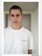 UNKNOWNWORLD Small Logo Cotton T Shirt in White - On Male Model