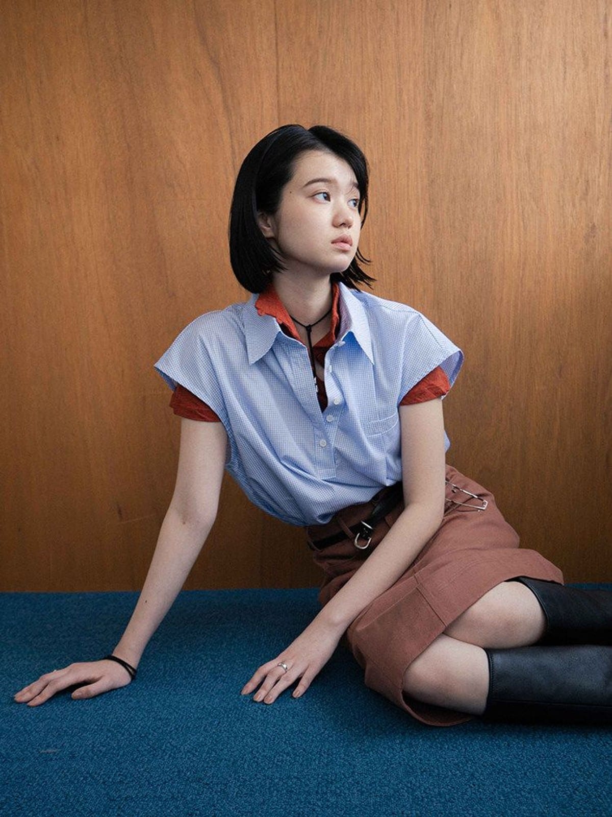 DOSORDONTS Plaid Pleated Pocket Polo Shirt in Light Blue - On Female Model