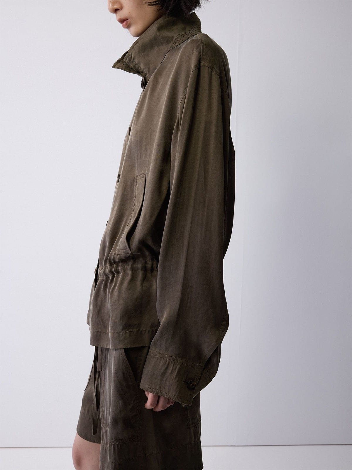 Random Piece Washed Stand Collar Peplum Jacket in Olive - On Female Model