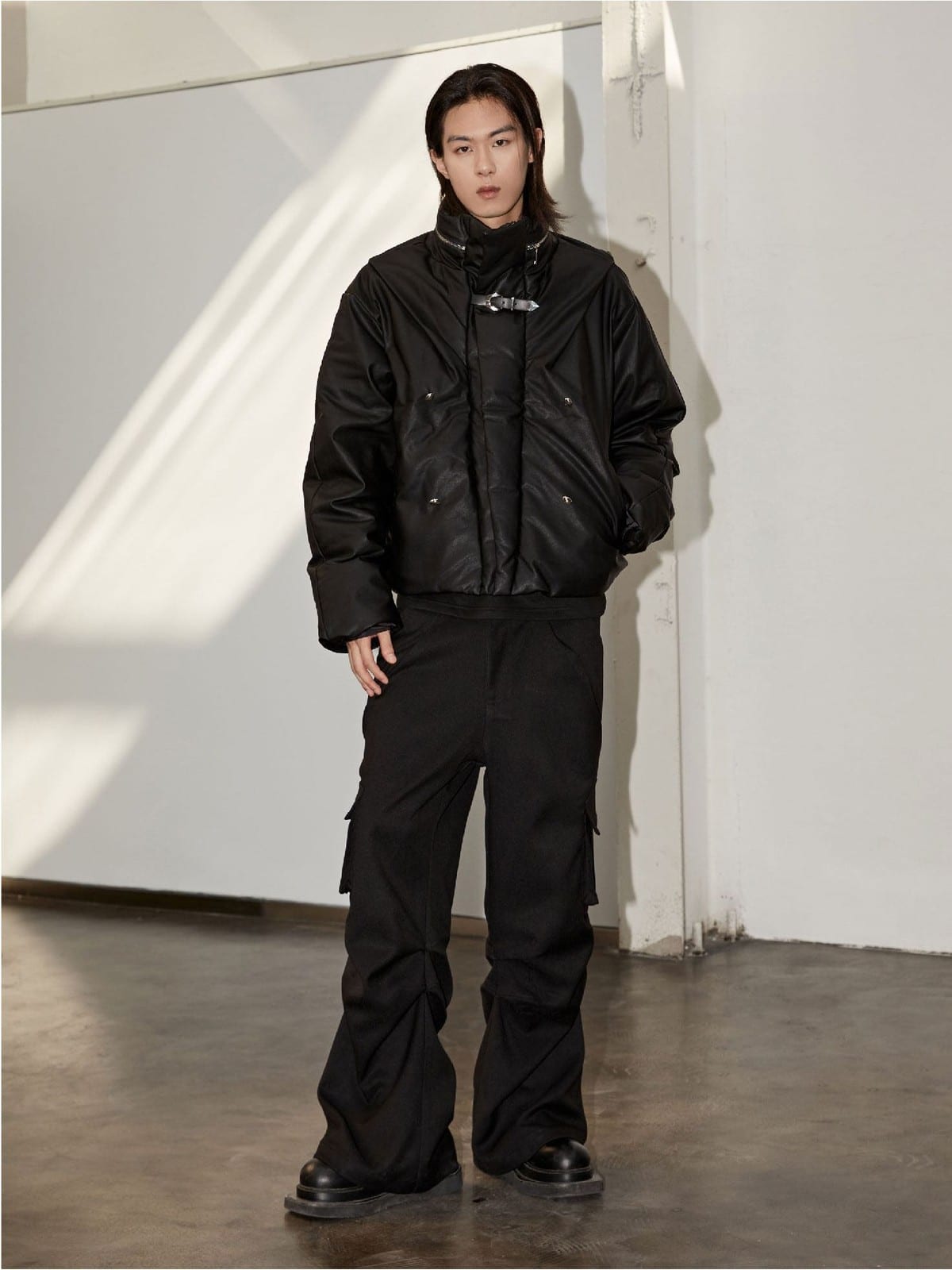 Y OFFICIAL Cropped Faux Leather Down Puffer in Black - On Male Model