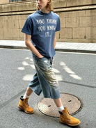 VLABMADE Distressed Slogan Boxy T Shirt in Blue - On Male Model