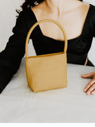 PANLULUPAN Waxed Cowhide Square Shoulder Bag in Yellow - On Female Model