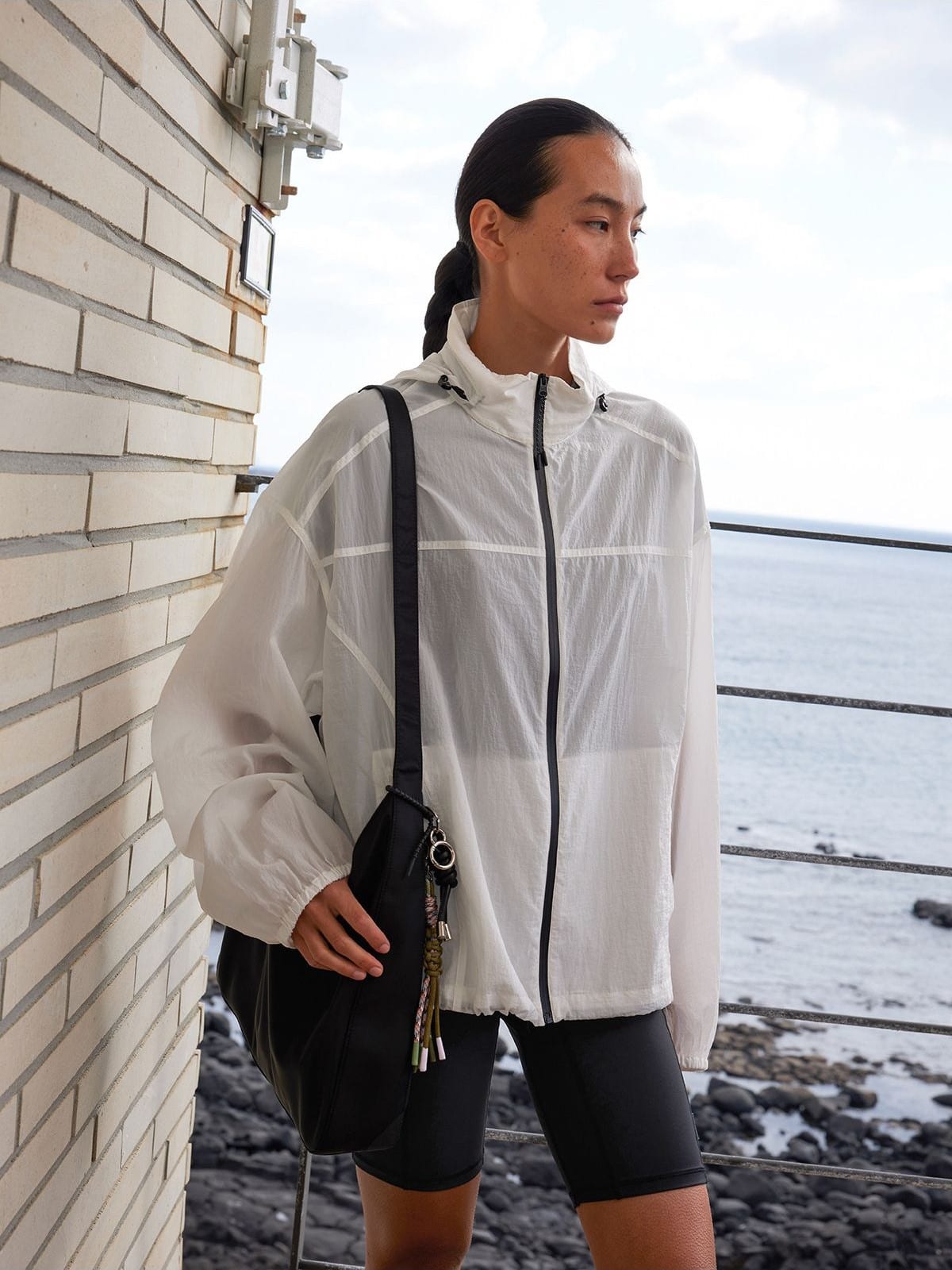 Random Piece Lightweight Cropped Hooded Nylon Jacket in White - On Female Model