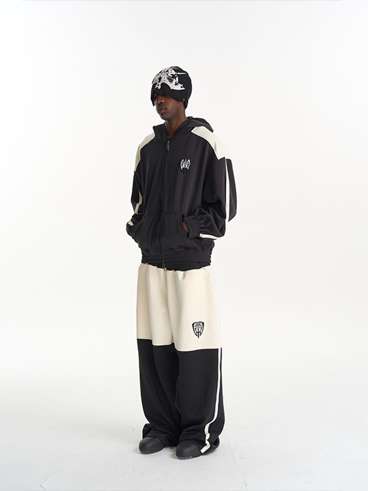 BLINDNOPLAN Hooded Colorblock Track Jacket in Black - On Male Model