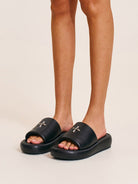 SMFK Cowhide Leather Cross Hardware Slides in Black - On Female Model
