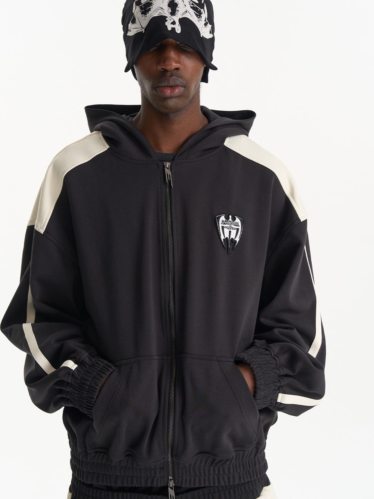 BLINDNOPLAN Hooded Colorblock Track Jacket in Black - On Male Model