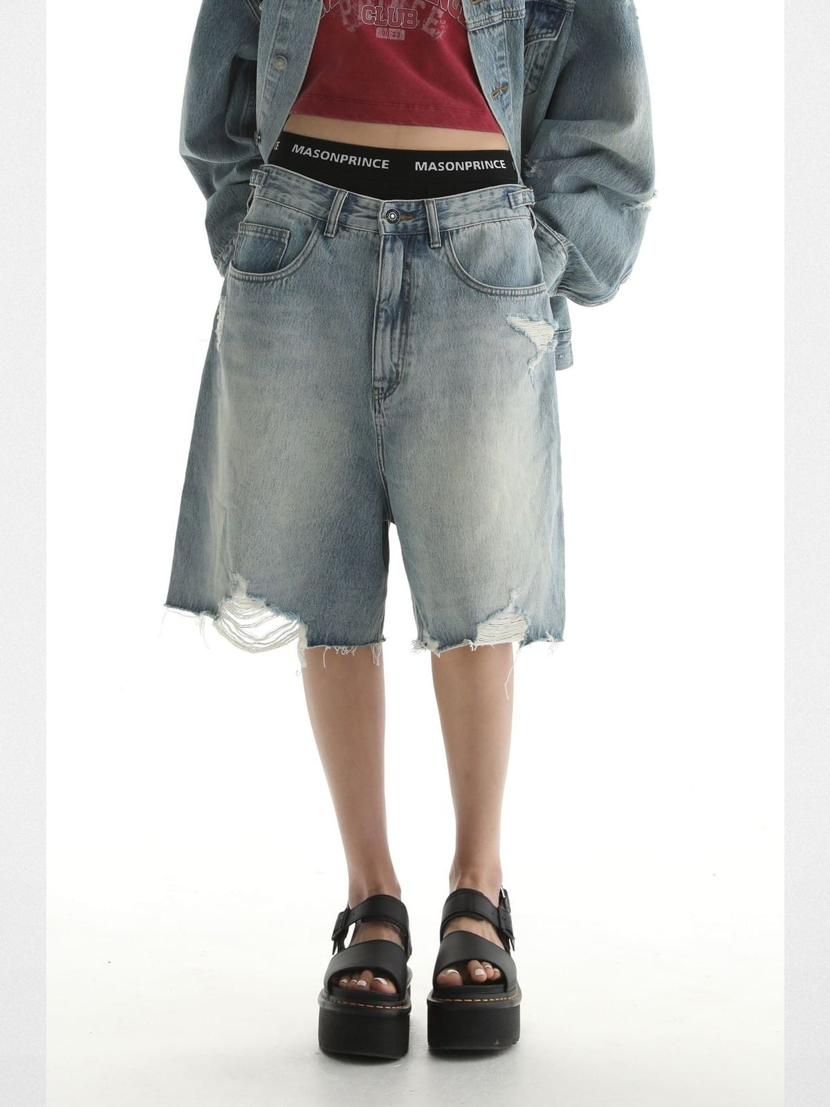 MASONPRINCE Light Wash Raw Hem Denim Shorts in Blue - On Female Model